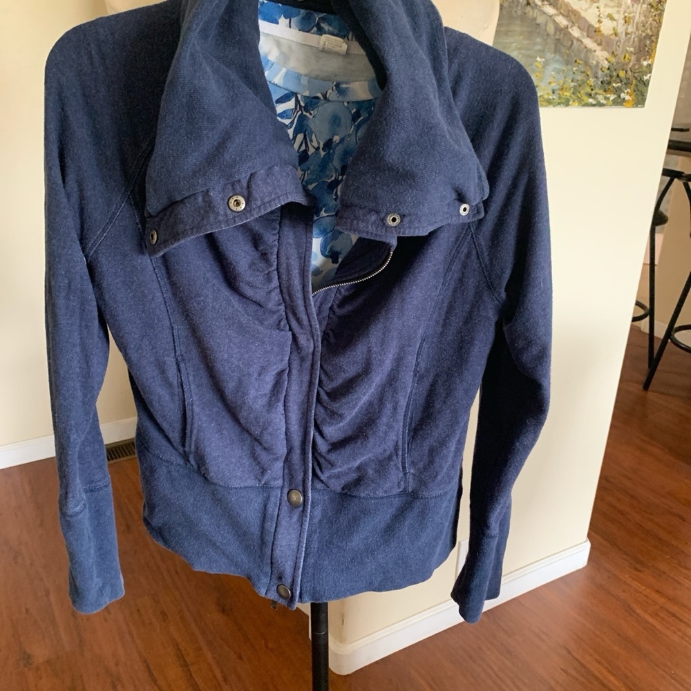 Women's Blue Jacket with zip and snap closure front pleating, side pockets.
